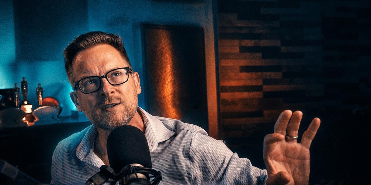 Brian Brushwood speaking into a studio microphone